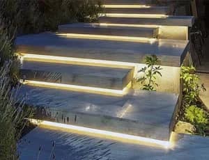 Linear LED strip lighting illuminating exterior stone steps