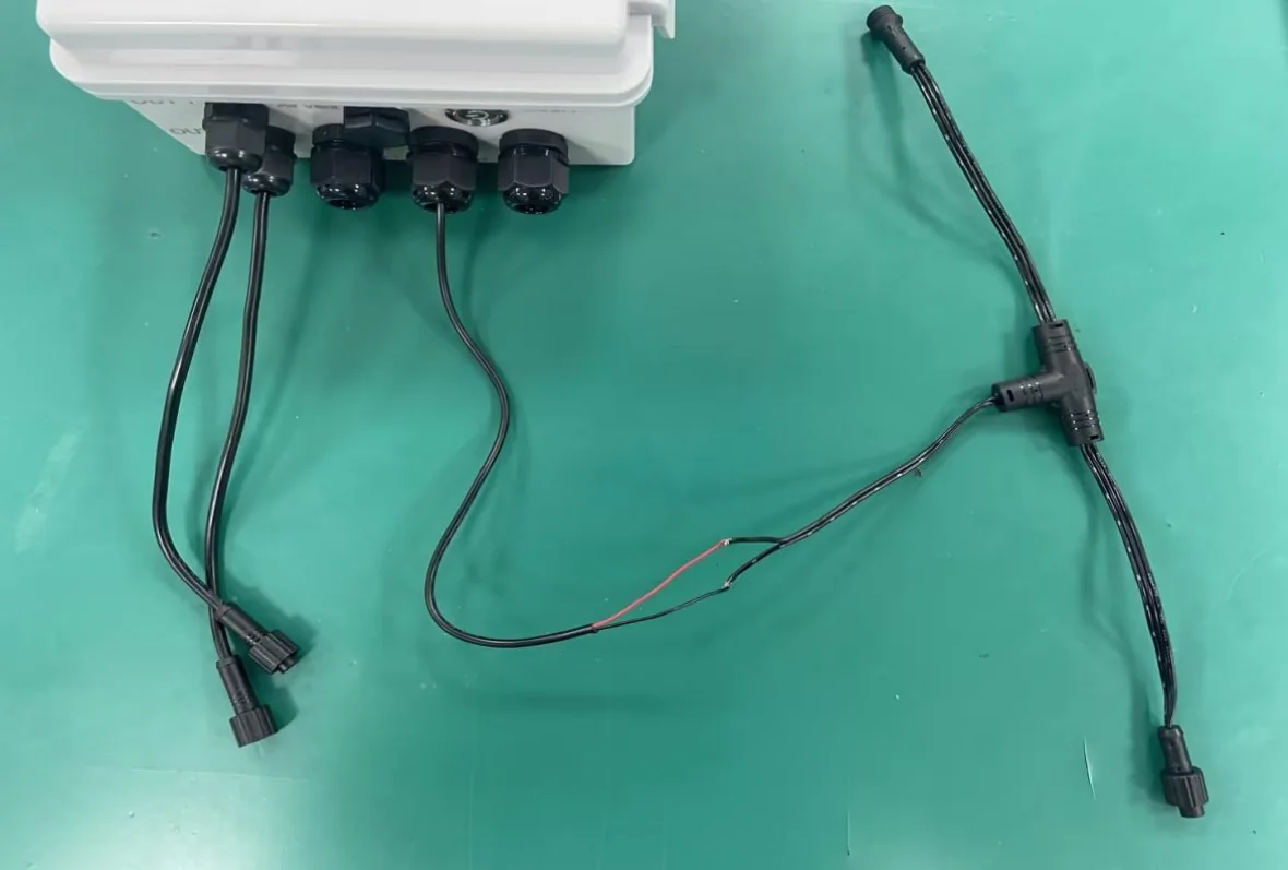 Controller power cable connected to a waterproof T connector for pixel light power injection