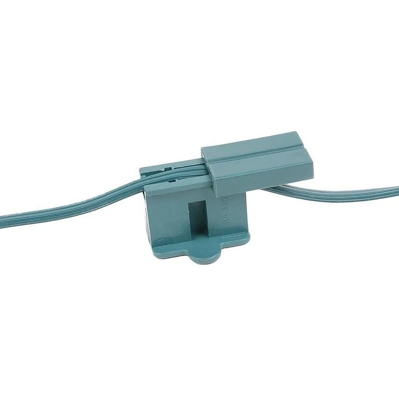 Green quick-connect vampire plug installed on compatible SPT Christmas light wire