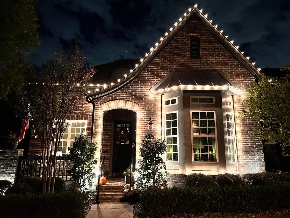 Warm white C9 lighting installed along a residential roofline
