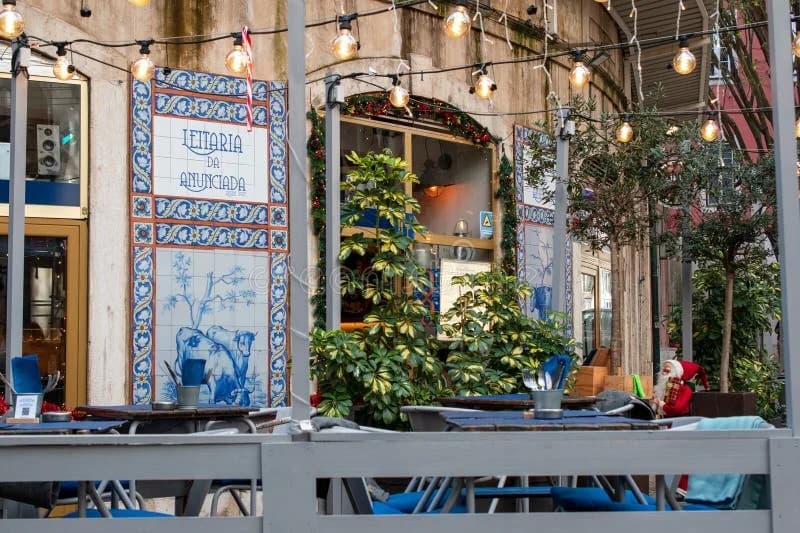 Commercial string lights installed over an outdoor restaurant patio