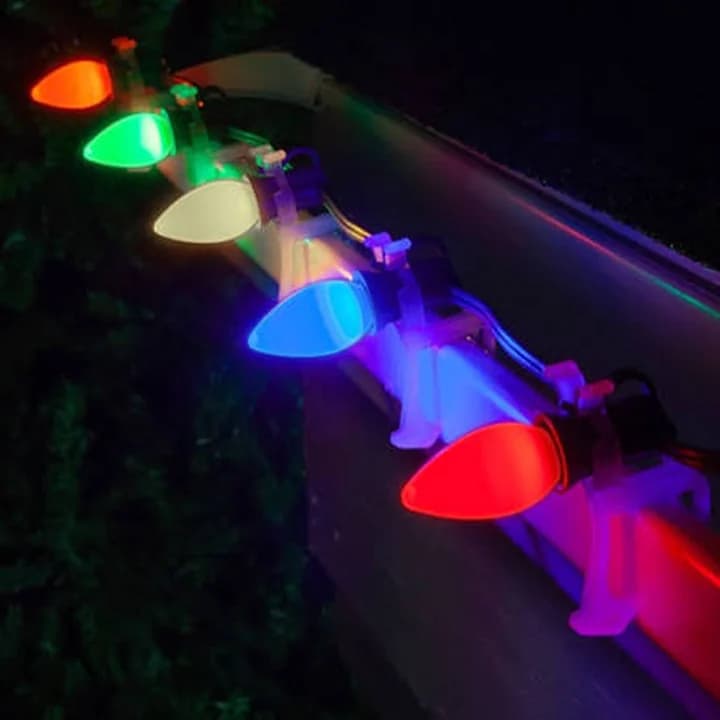 Illuminated C7 opaque LED bulbs installed in commercial E12 sockets