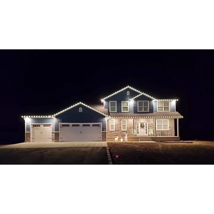 C9 opaque LED Christmas bulbs installed on a residential roofline