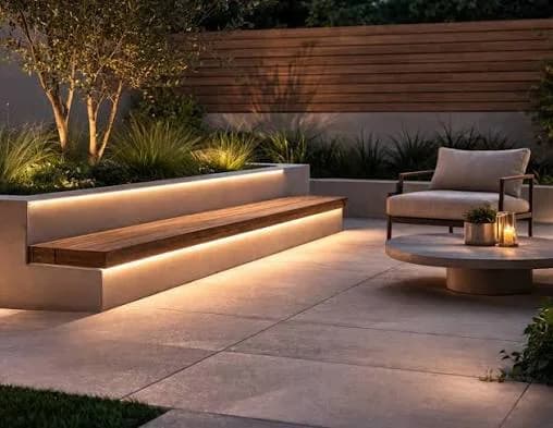 Warm white LED strip lighting integrated into outdoor landscape steps and seating